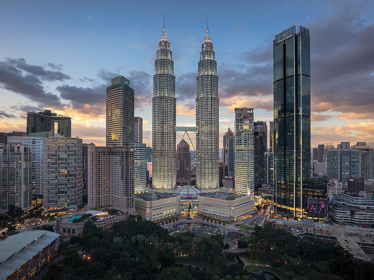 Petronas Twin Towers and the Kuala Lumpur skyline at dusk